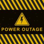 Yellow and black warning graphic with diagonal hazard stripes and glowing dots, featuring a triangular electric bolt icon above bold yellow text that reads "POWER OUTAGE" on a dark background.