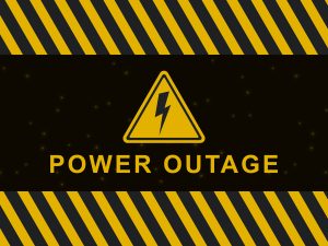 Yellow and black warning graphic with diagonal hazard stripes and glowing dots, featuring a triangular electric bolt icon above bold yellow text that reads "POWER OUTAGE" on a dark background.
